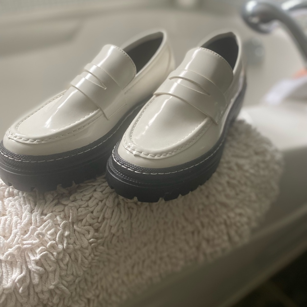 Madden Girl White and Black Slip-On Loafers with Sleek Design